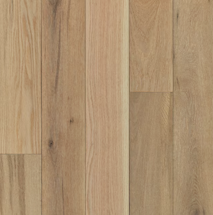 Light - toned oak flooring with natural wood grain and subtle knots, embodying a warm and rustic aesthetic.